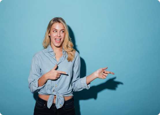 happy-blonde-woman-shirt-pointing-away
