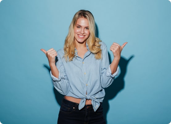 happy-blonde-woman-shirt-pointing-away